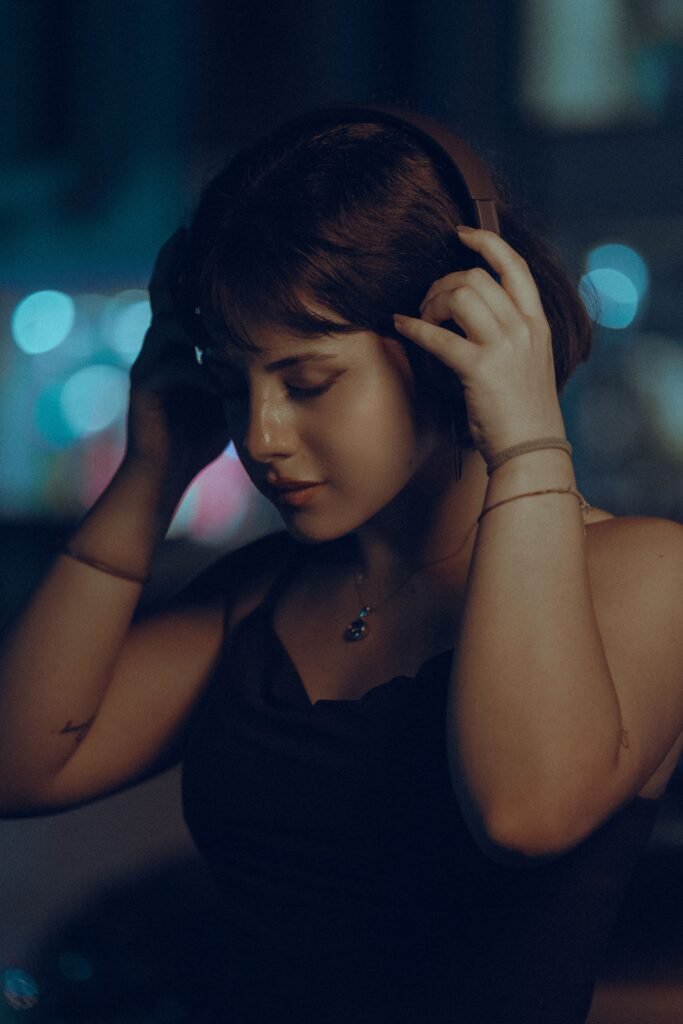 Can you fall in love with someone's voice? Woman listening intently with headphones, experiencing emotional attraction.